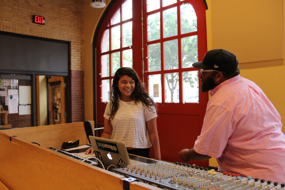 Corey DePina, Musician and Youth Development and Performance Manager at Zumix, talks with a youth musician.